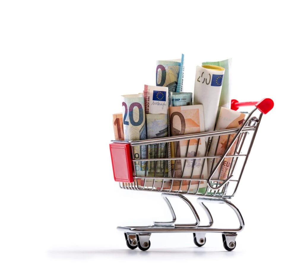 Shopping trolley piled high with euro banknotes